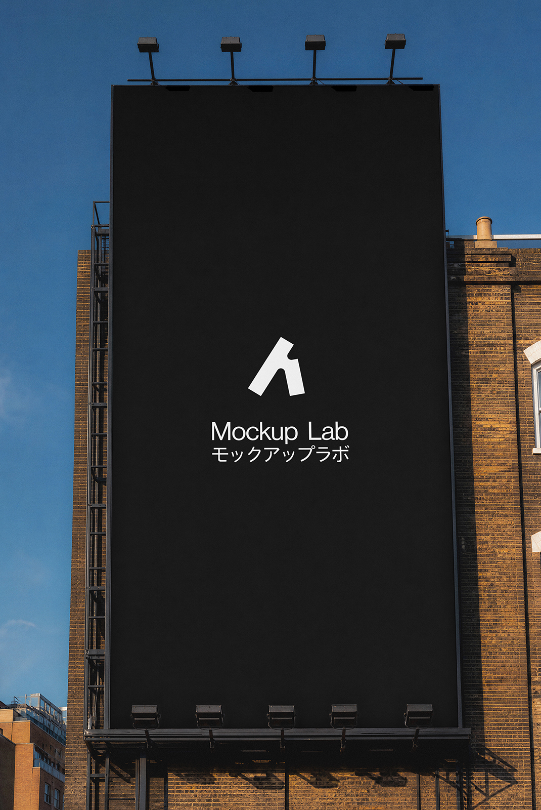 Front view of a large billboard mockup against a clear blue sky, ready for design.